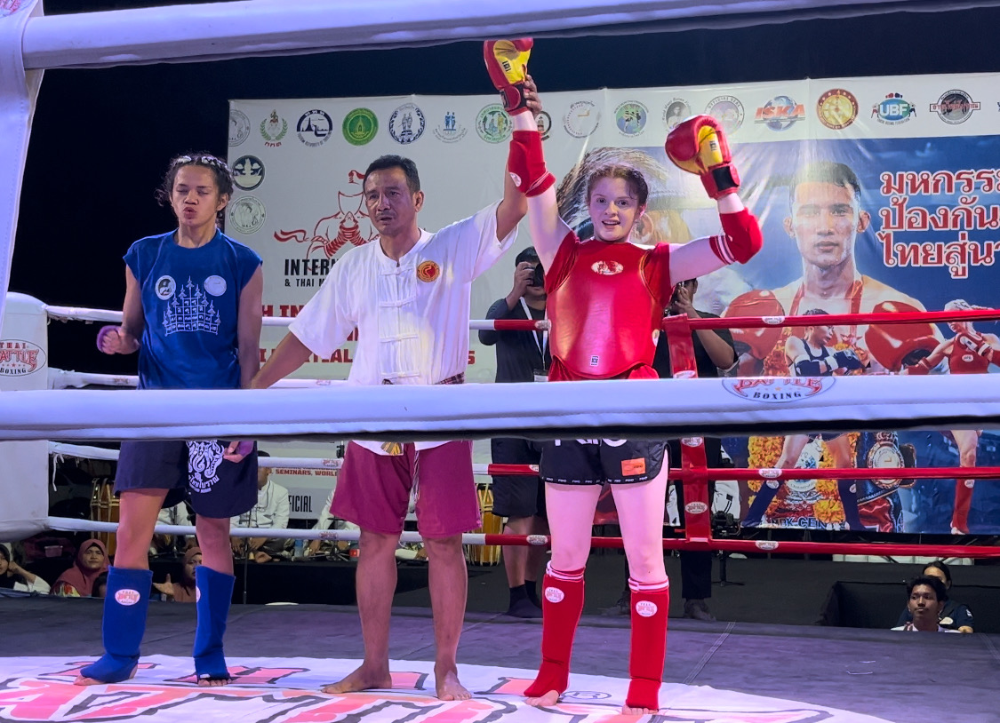 WMO USA athlete with hand raised at the World Championship in Bangkok
