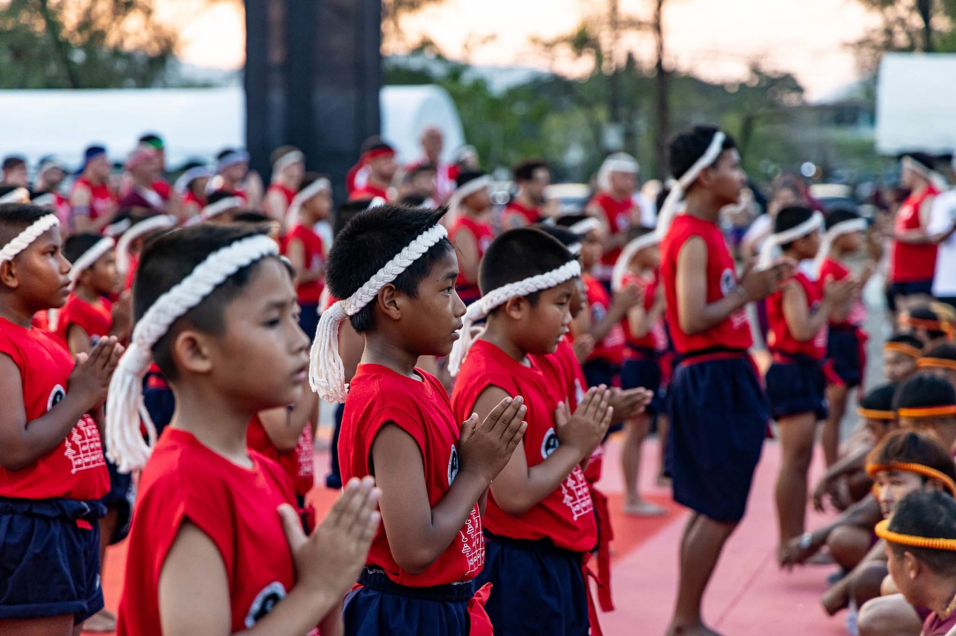 Young Muaythai fighter performing Wai Kru ceremony