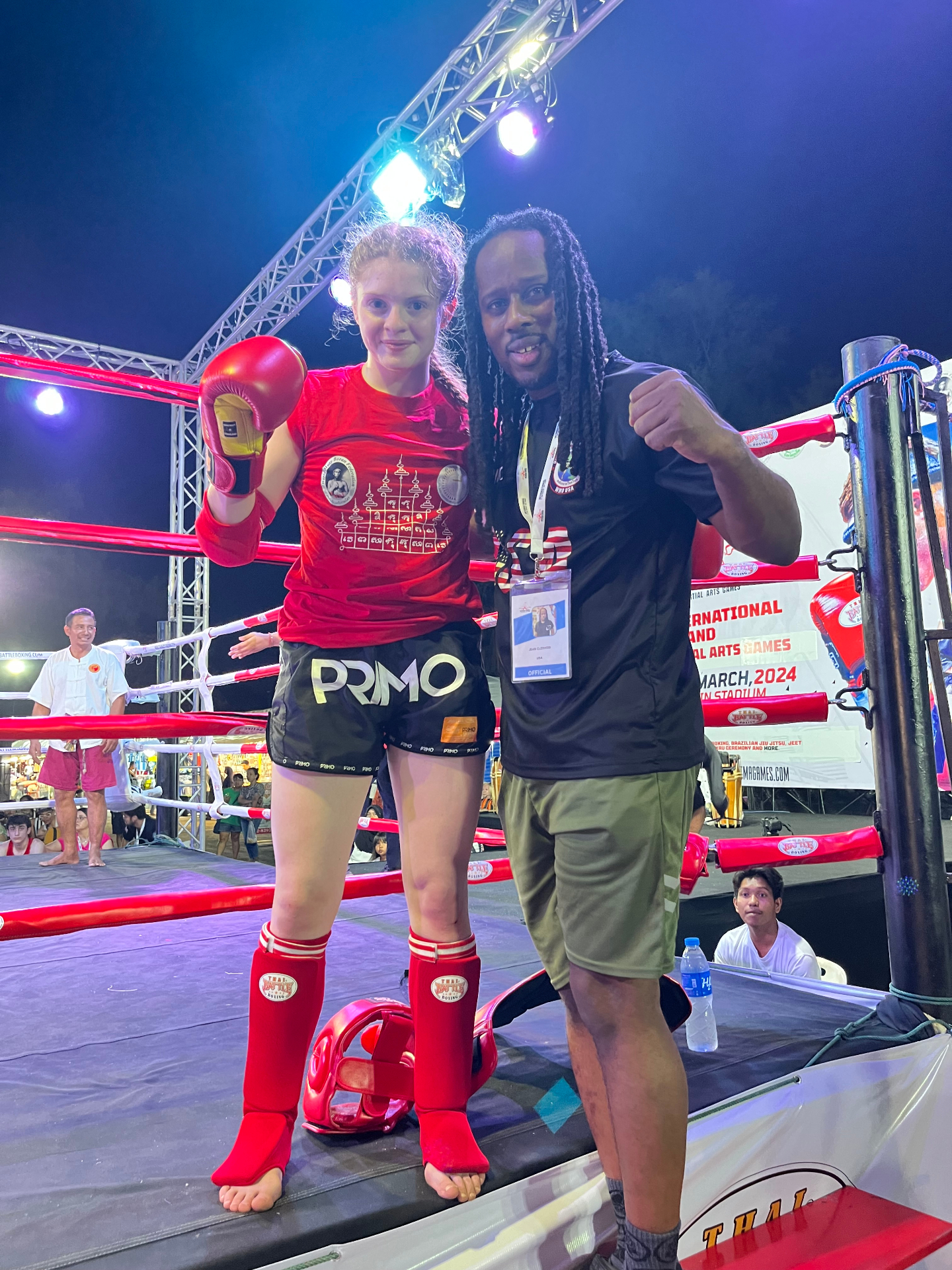 WMO USA fighter and official posing ringside in Thailand