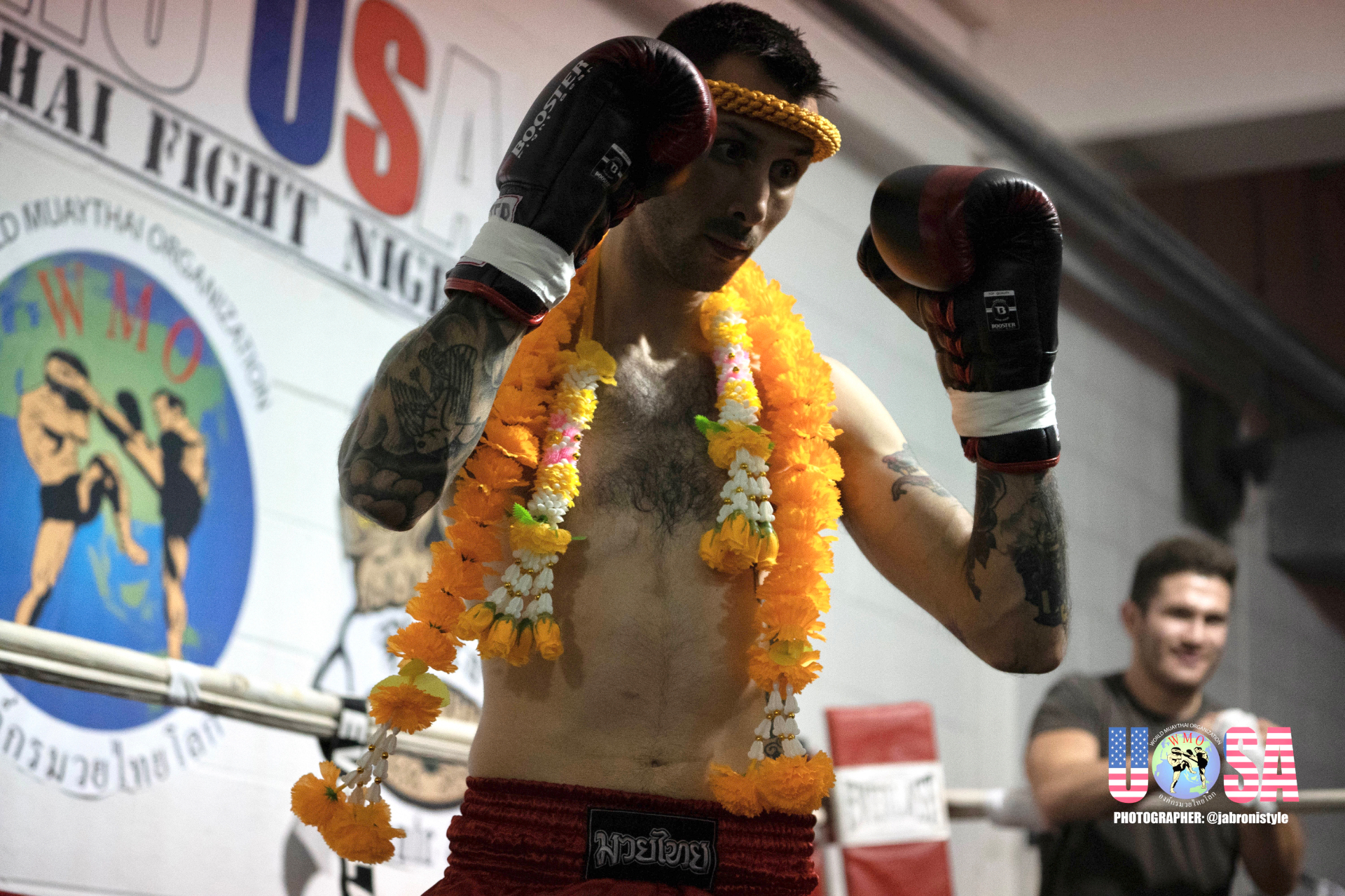 WMO USA fighter wearing mongkol and ceremonial garland inside the ring