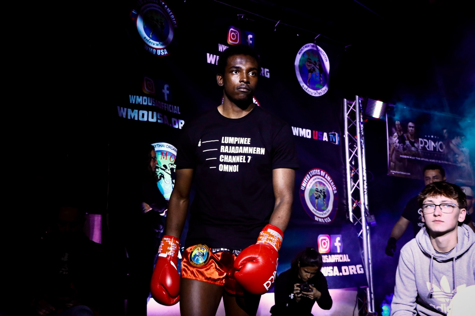 WMO USA fighter making his ring entrance under the official backdrop