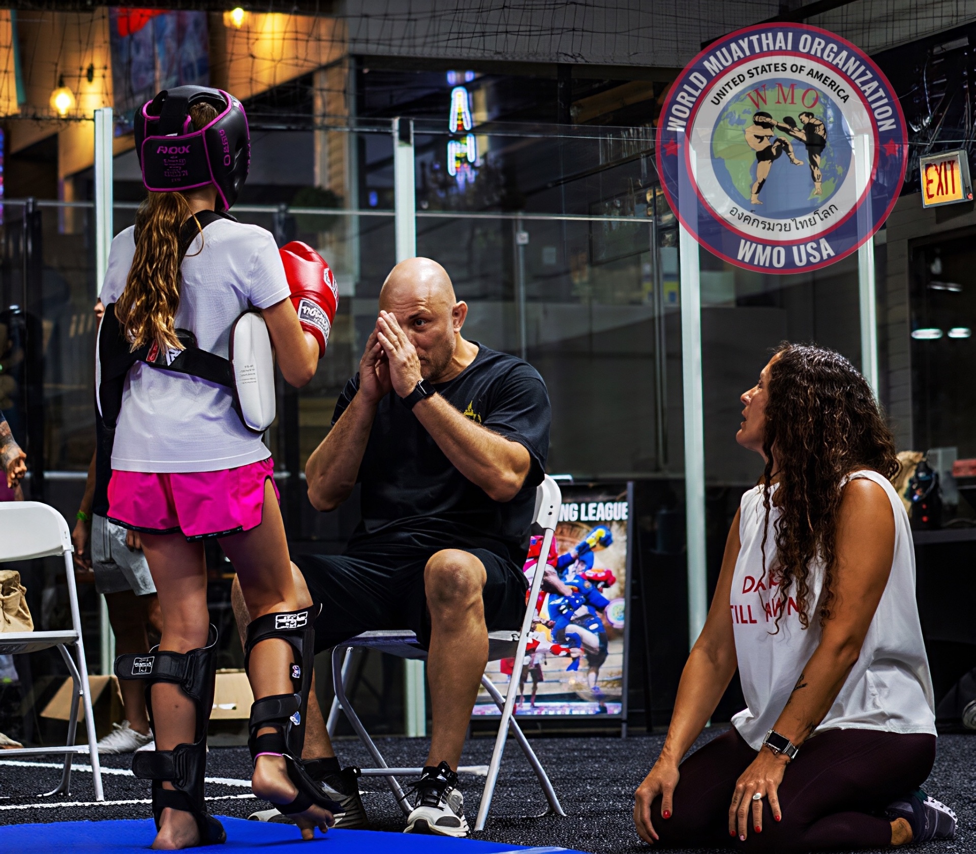 WMO coach giving corner instruction to a young fighter