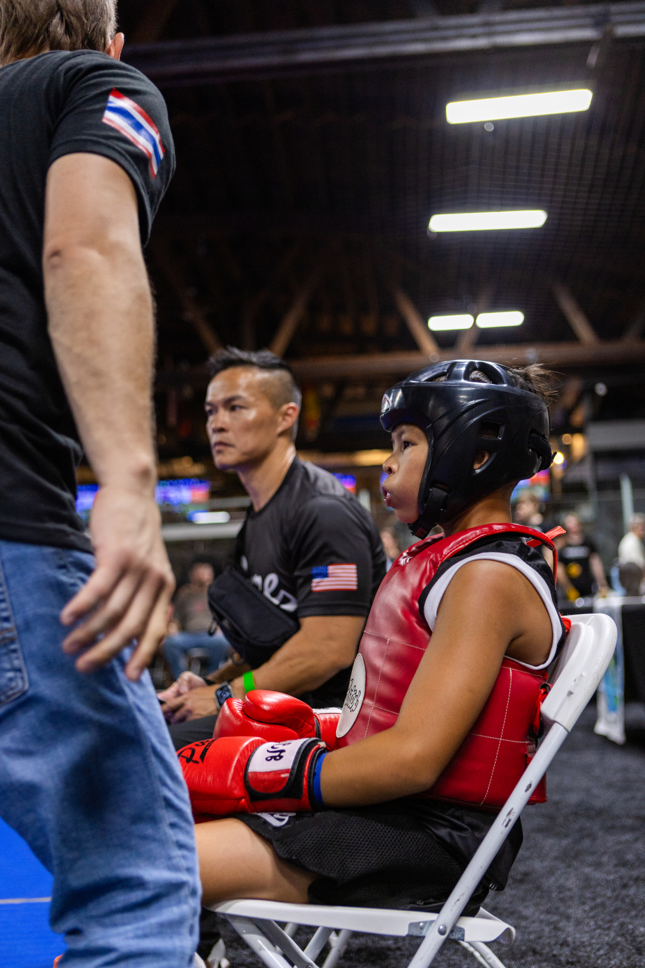 Young Learning League athlete waiting in the corner with WMO USA official